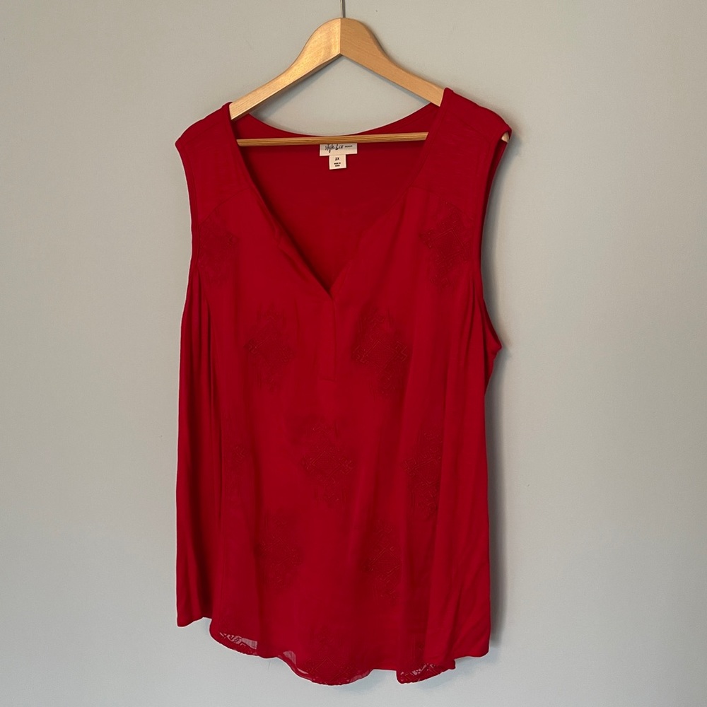 red sleeveless tank top with embroidered pattern